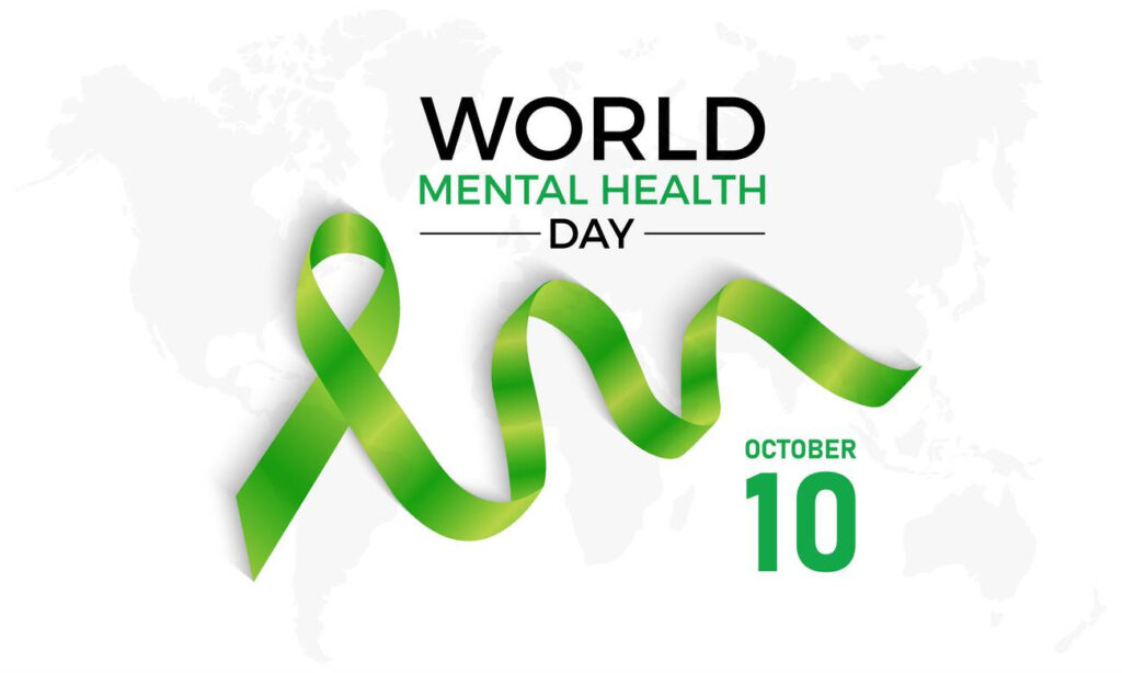 Graphic for World Mental Health Day 2024 featuring a green ribbon and a world map in the background.